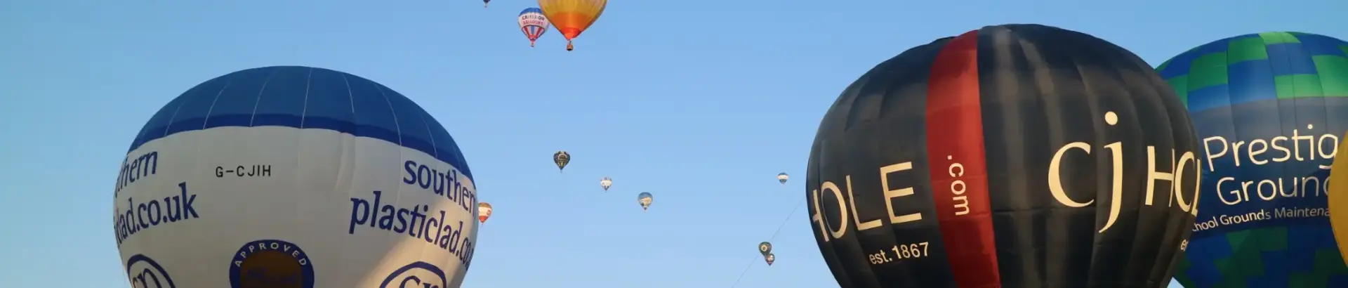 Multiple hot air balloons taking off