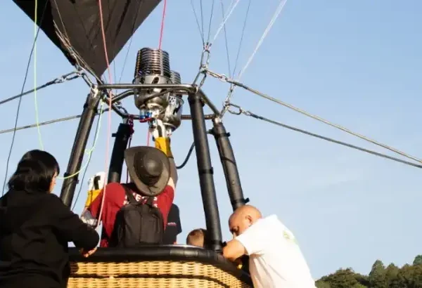 People in a hot air balloon basket
