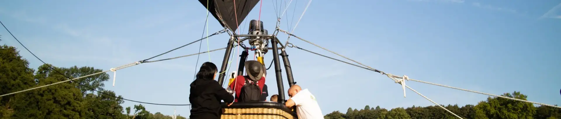 People in a hot air balloon basket